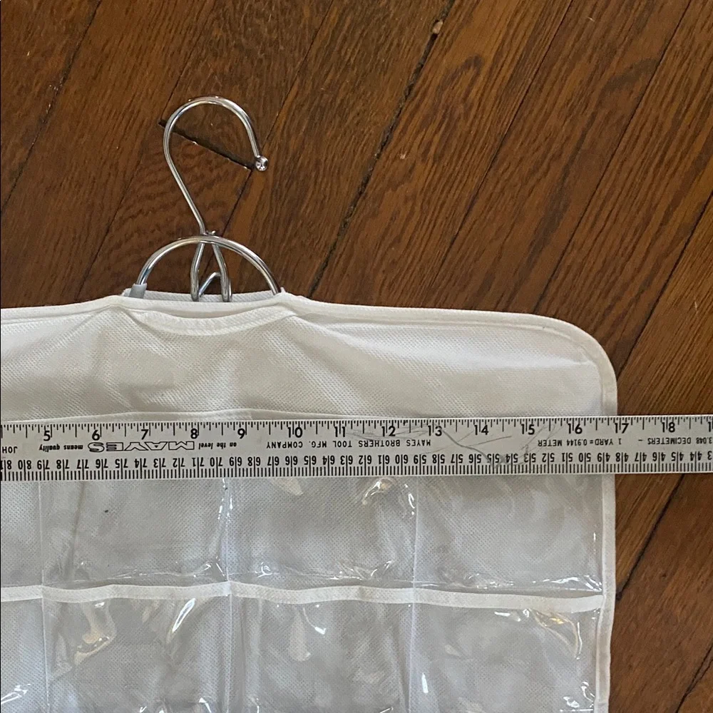 Double-Sided Jewelry Organizer with 80 Clear Pockets hangs in closet